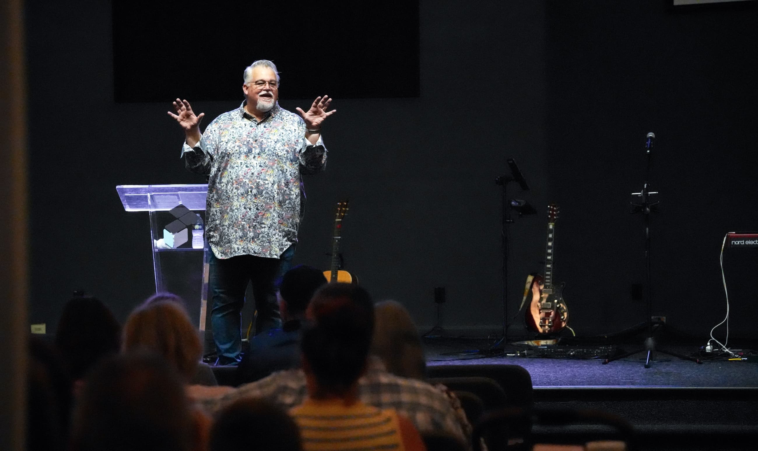 Pastor Steve Stewart teaching on stage